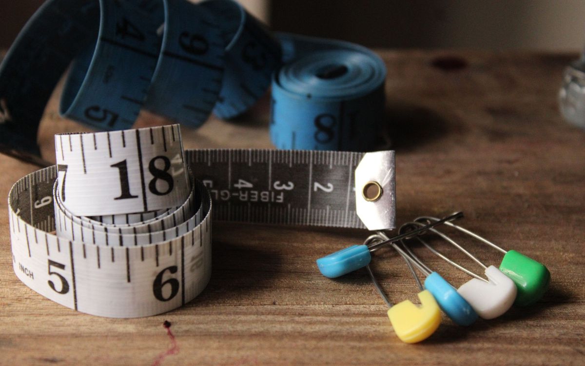 Tape measures lying on a wooden surface